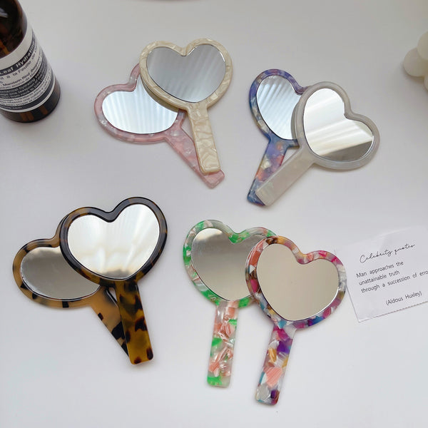 "Reflect your heart" heart-shaped handheld mirror