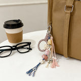 上品な輝きのポータブルミラー付き！パールとリボンのマルチストラップチャーム