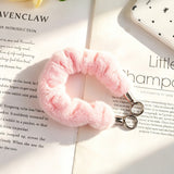 "Add a soft pop of color to your daily essentials" Fluffy smartphone wrist strap with holder sheet