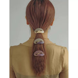 An infinity symbol that's both elegant and cute shines in your hair. Round ribbon twisted metal hair clip.