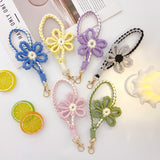 Heart-fluttering, hand-knitted flowers. Macaron-colored floral motif smartphone strap | Adorably chic rose gold shimmer [6 colors total]