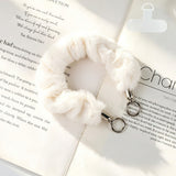 "Add a soft pop of color to your daily essentials" Fluffy smartphone wrist strap with holder sheet