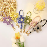 Heart-fluttering, hand-knitted flowers. Macaron-colored floral motif smartphone strap | Adorably chic rose gold shimmer [6 colors total]