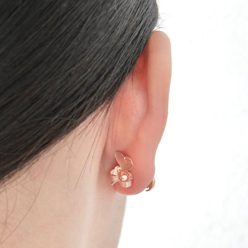 Copper earring backs with "Shaded Flower" motif