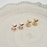 Copper earring backs with "Shaded Flower" motif