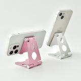 "Lean your back" Folding smartphone/tablet stand