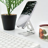 "Lean your back" Folding smartphone/tablet stand