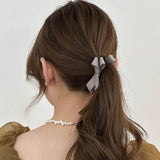 "Adult Cute" for Everyday. Sophisticated Banana Clip with Elegant Ribbon Finish