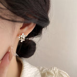 "The finishing touch for a lady" Freshwater pearl and small flower earrings