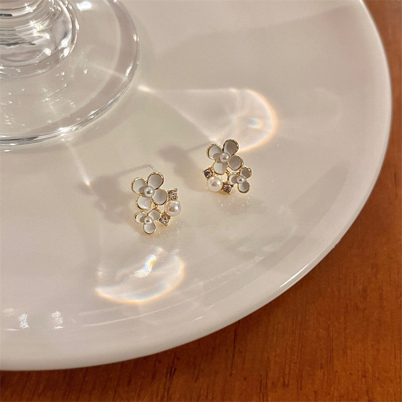 "The finishing touch for a lady" Freshwater pearl and small flower earrings