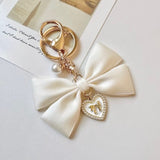 "Maiden's Promise" pearl ribbon charm