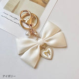 "Maiden's Promise" pearl ribbon charm