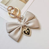 "Maiden's Promise" pearl ribbon charm