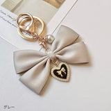 "Maiden's Promise" pearl ribbon charm