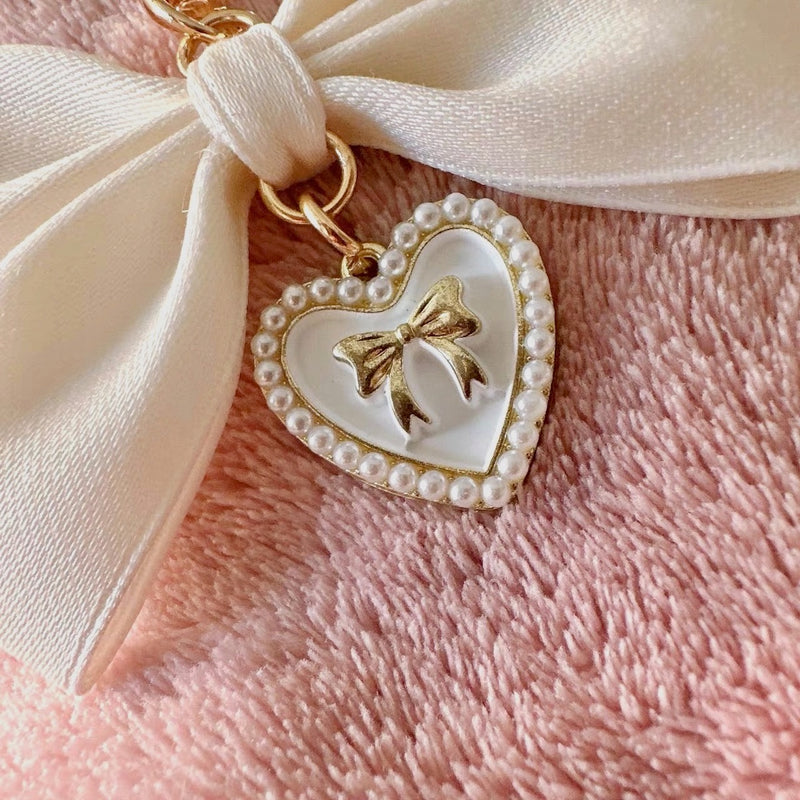 "Maiden's Promise" pearl ribbon charm