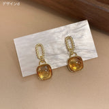 "Okonomi Amber" Amber-style design earrings